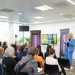 RN speaking at event