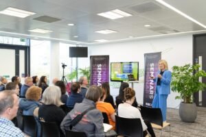 RN speaking at event